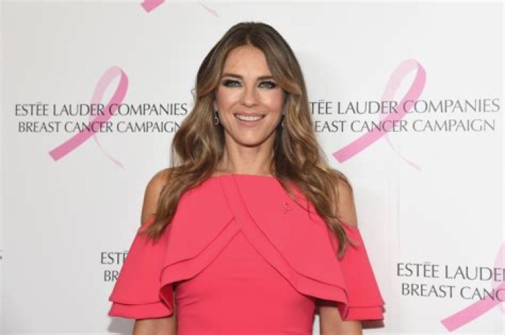 Elizabeth Hurley Shows Off Curves in Aqua Chain Swimwear — Celebwell